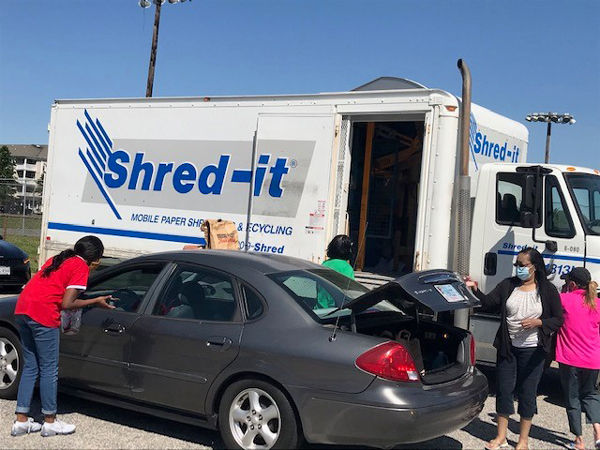 Shred Day in action and the vehicle filled with our food collection for VA Peninsula Foodbank.
