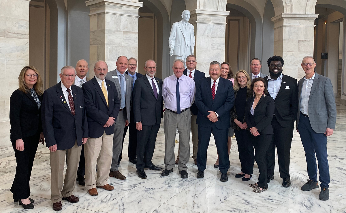 Credit union and League representatives meet with Sen. Tim Kaine in the U.S. Capitol.