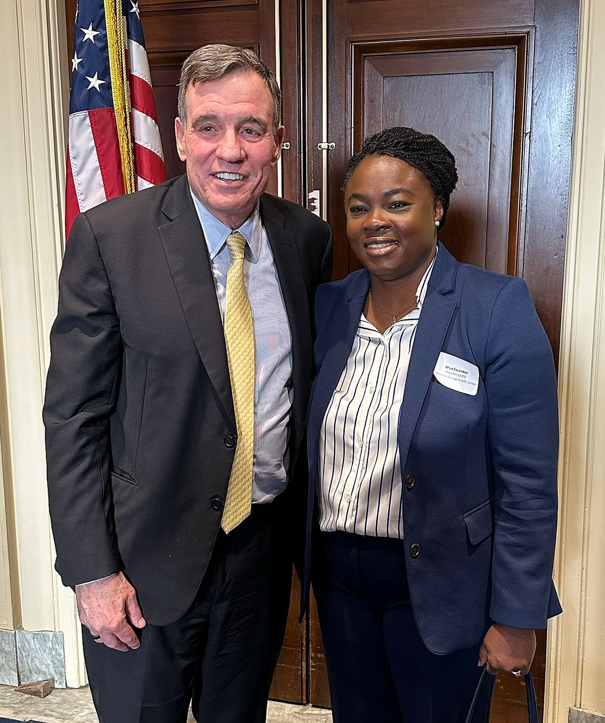 Sen. Mark Warner with Dominion Energy CEO Afua Essandoh.