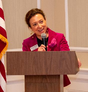 League President/CEO Carrie Hunt welcomes lawmakers to Credit Union House for a reception spotlighting Community Development Financial Institutions (CDFI).